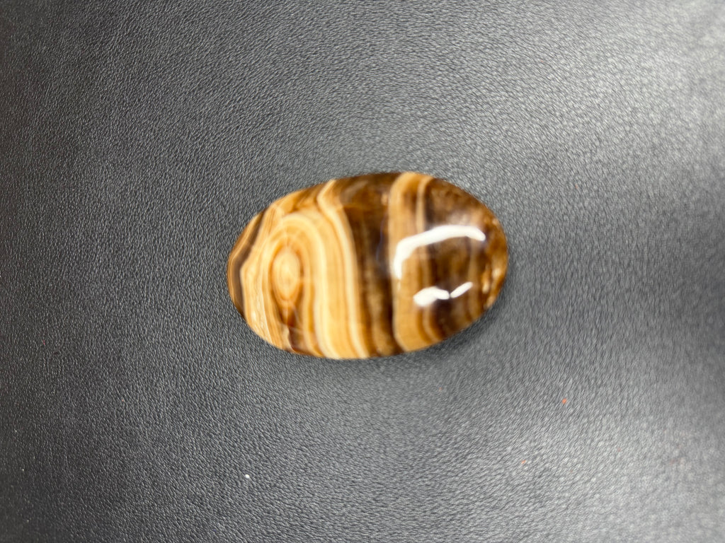 Chocolate calcite palm stone